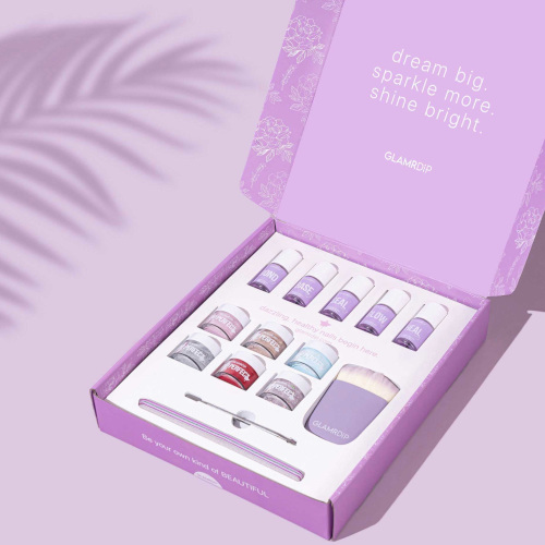 Purple background and box with nail kit