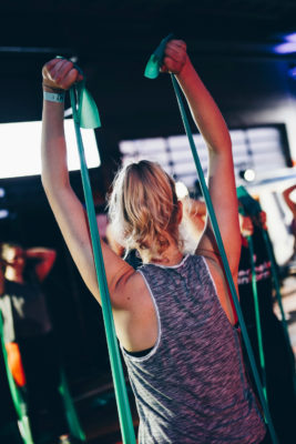 Woman exercising in class | Fitness Classes & Studios in London