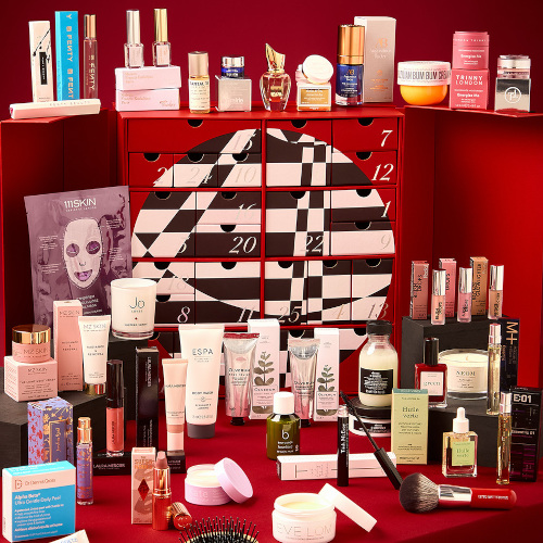 Red, black and white box surrounded by beauty products