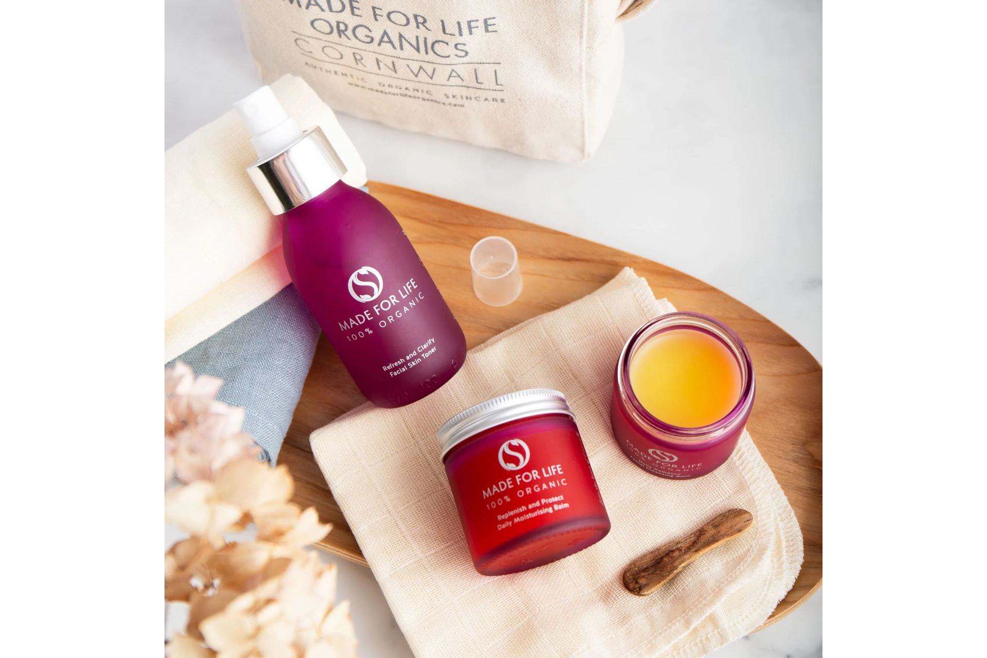Beauty products on wooden board
