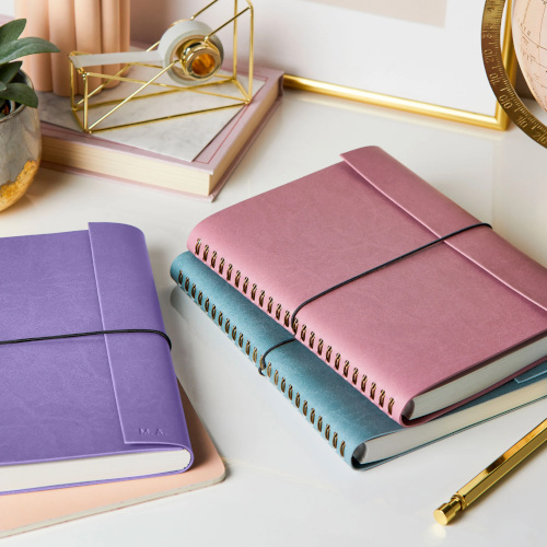 2025 diaries stacked up