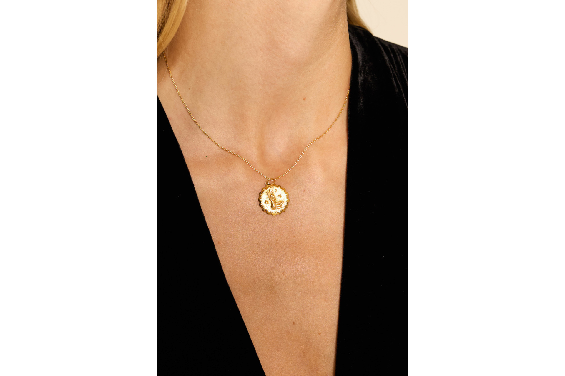 Close up of neck with gold necklace