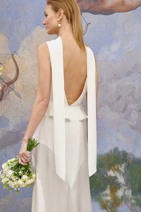 Woman in backless wedding dress