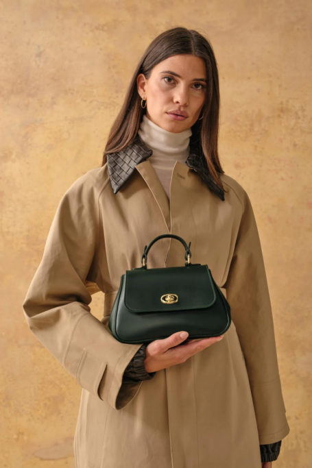 Woman holding green bag