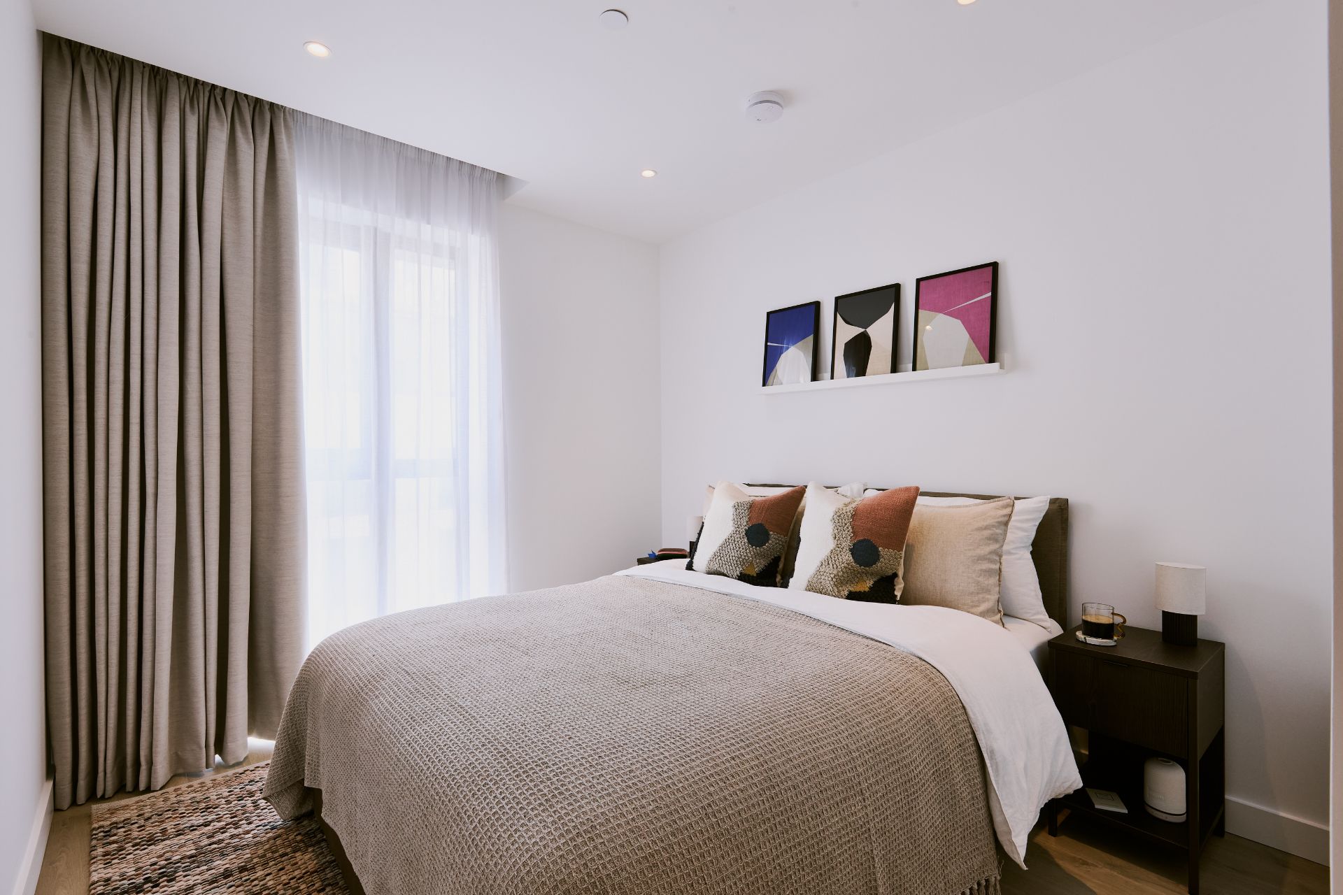 Bedroom with taupe bedspread 