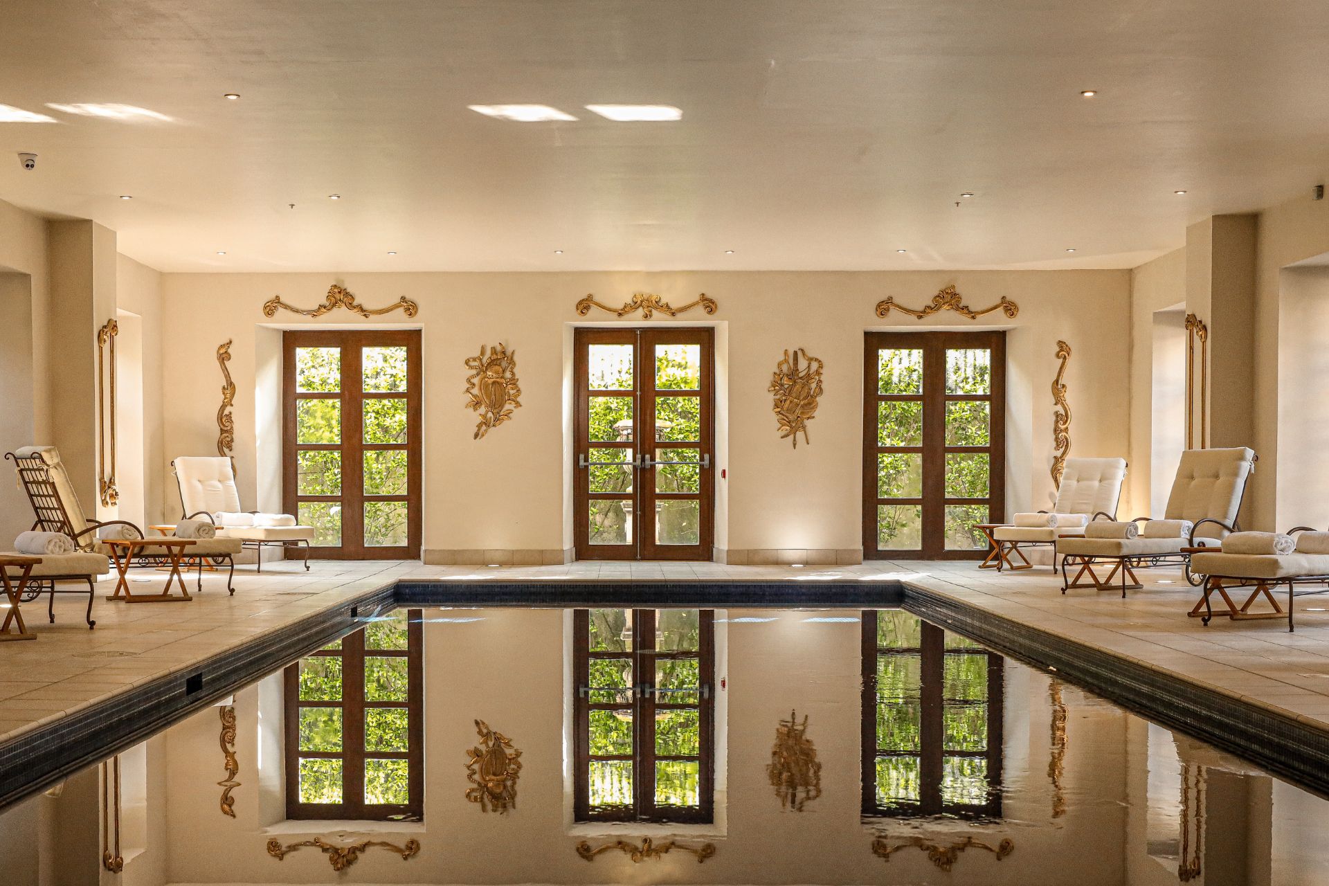 Indoor swimming pool with French windows