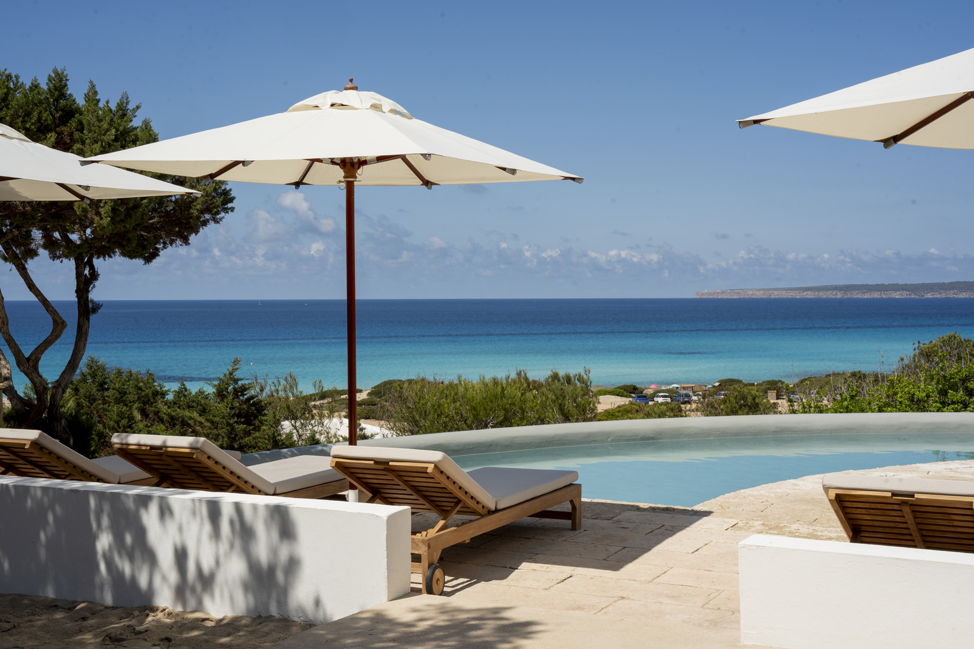 The pool at Dunas de Formentara with the sea on the horizon