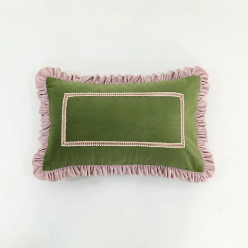 Green velvet cushion with pink ruffled edge