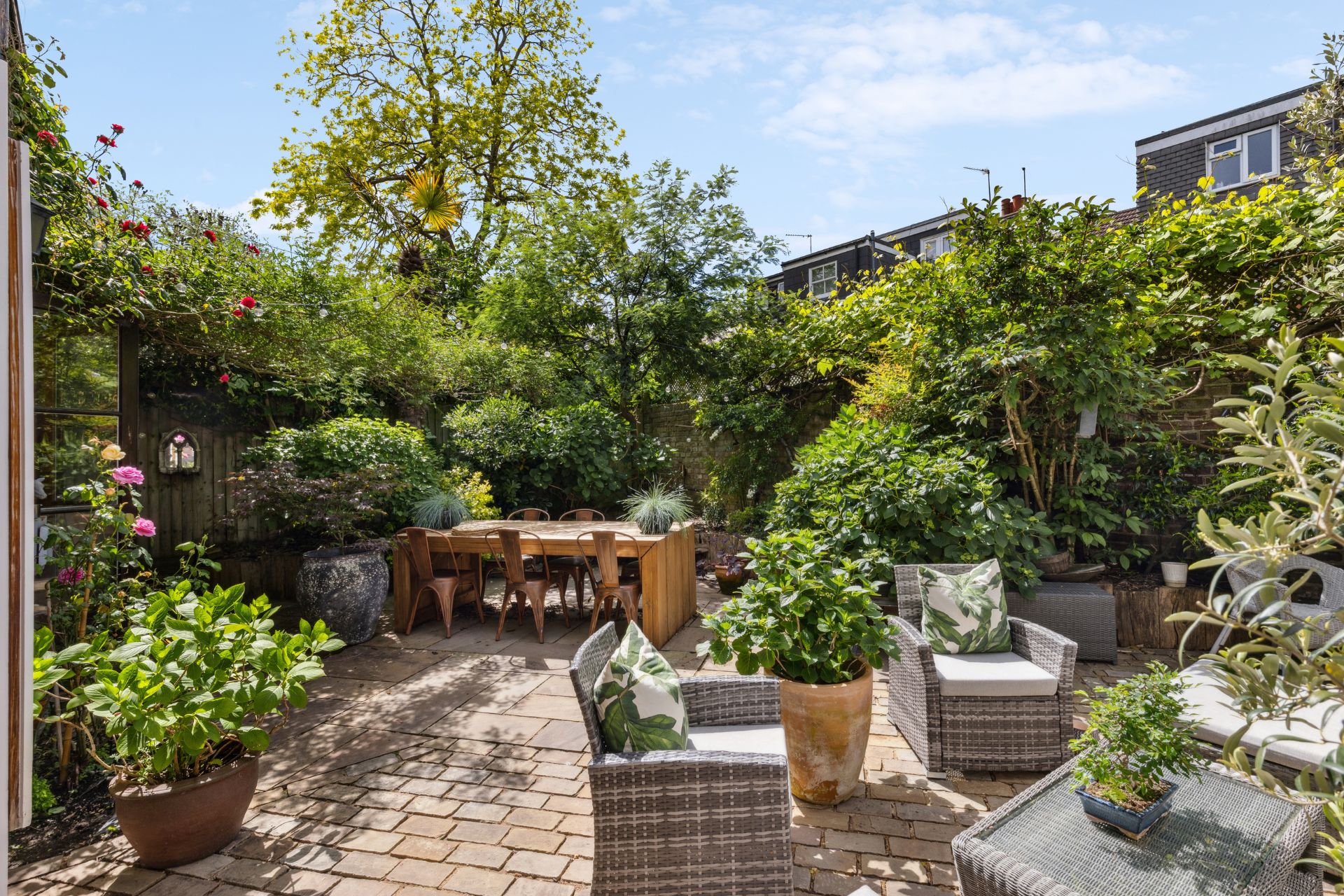 Rear garden with patio and dining area