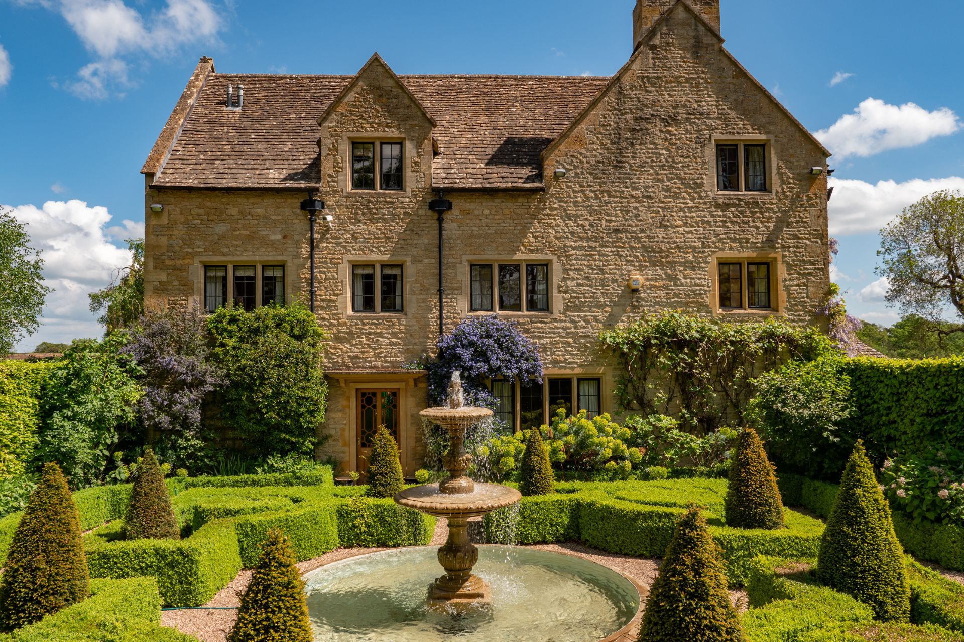 Cotswold stone house with landscaped garden