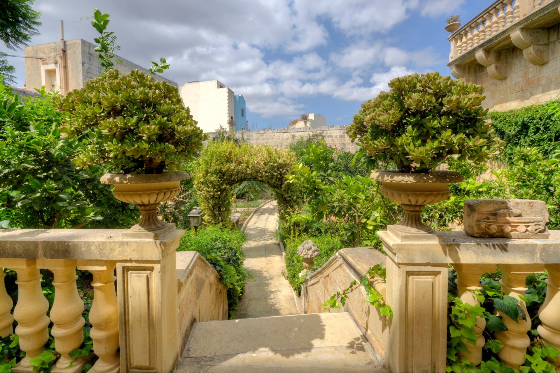 Courtyard with stone pillars and fruit trees