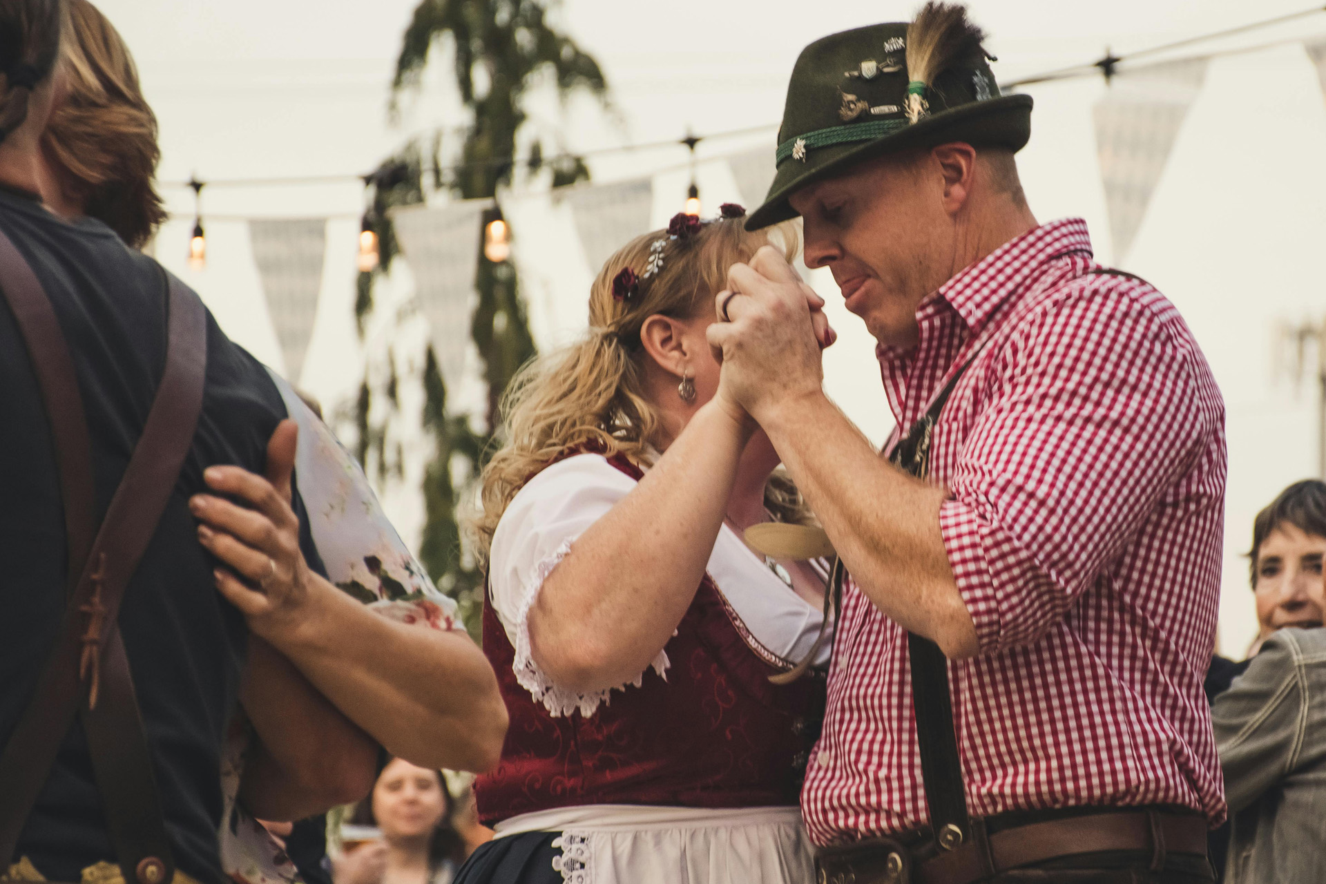 Two people dancing in Bavarian outfits