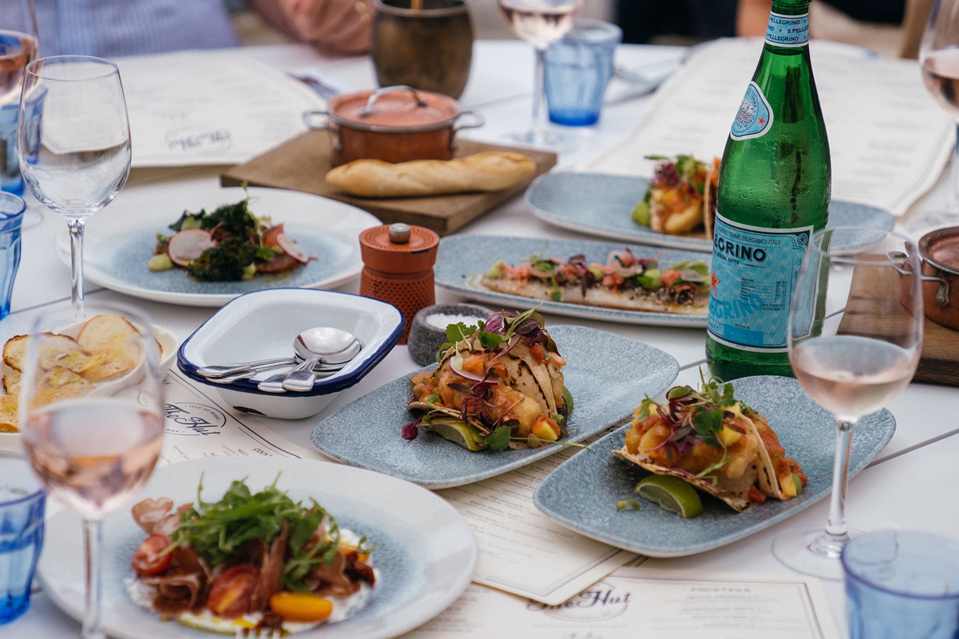 Seafood spread with a bottle of San Pellegrino