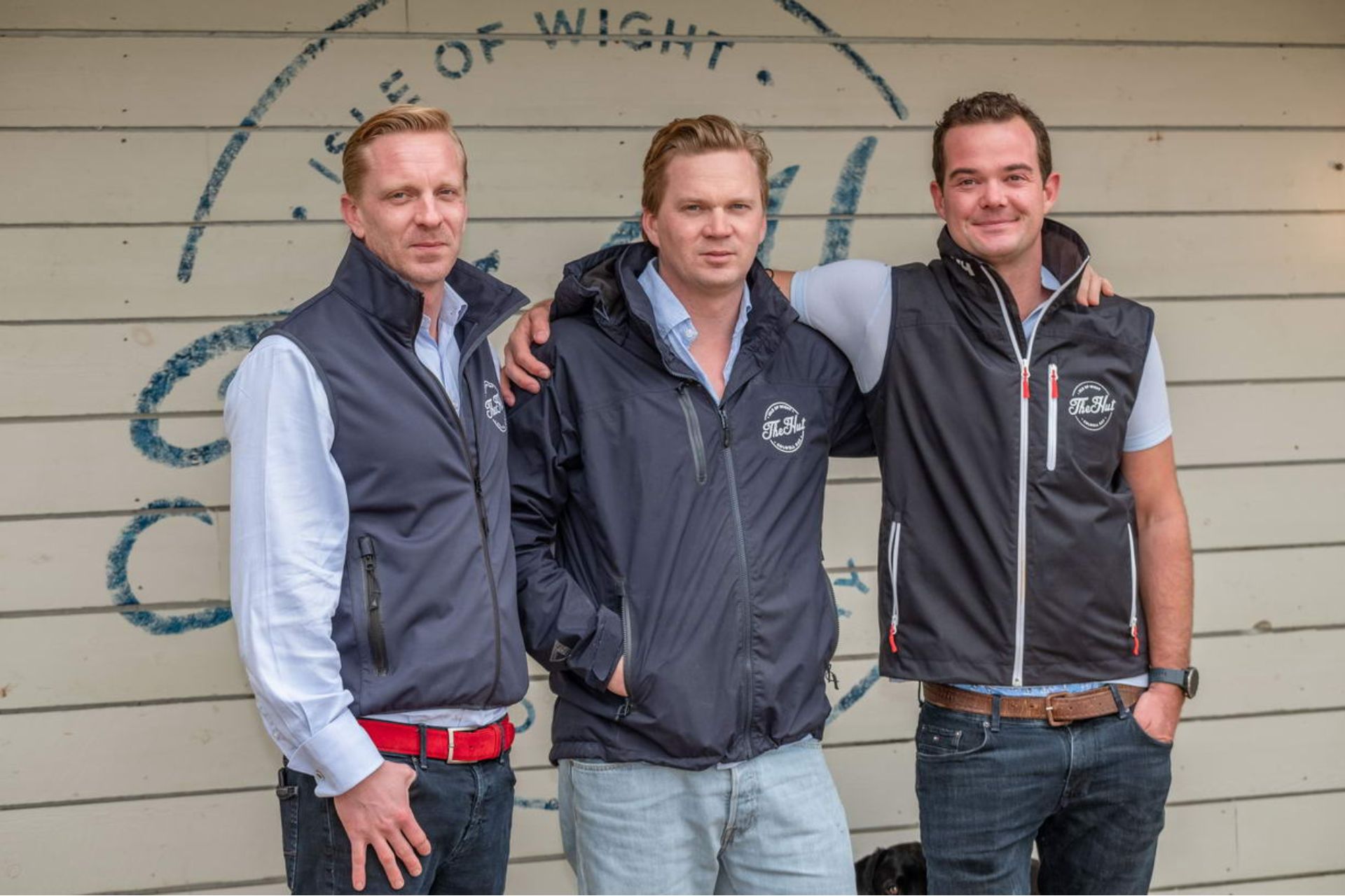 The Hut owners wearing branded navy gilets