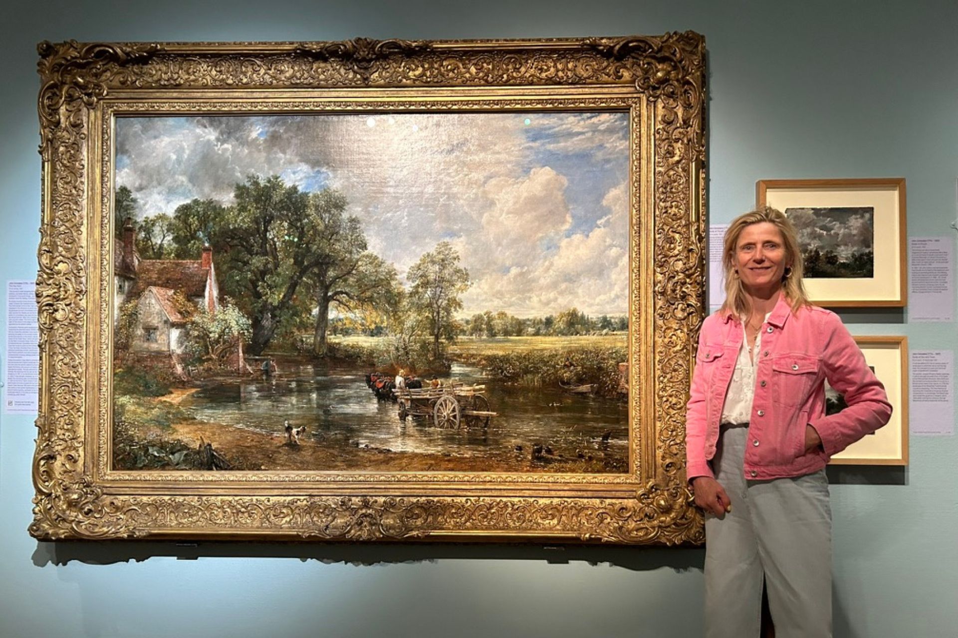 Woman standing next to painting in National Gallery