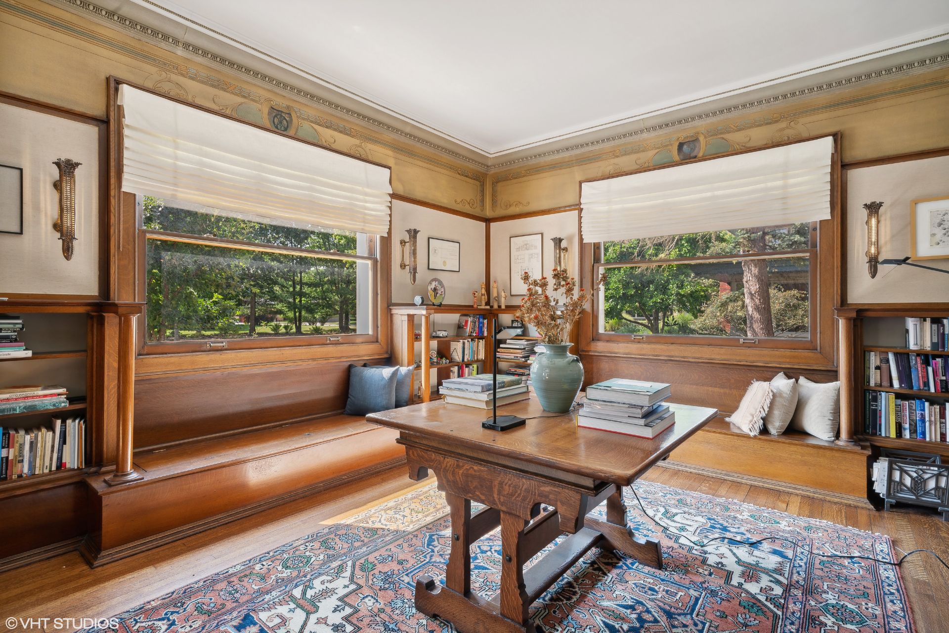 Wood-panelled living room with central wooden table