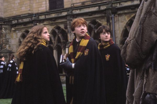 Emma Watson as Hermione Granger, Rupert Grint as Ron Weasley and Daniel Radcliffe as Harry Potter in Harry Potter and the Chamber of Secrets (2002).