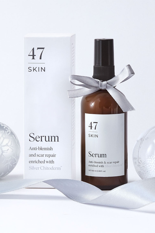 Bottle of serum next to white box