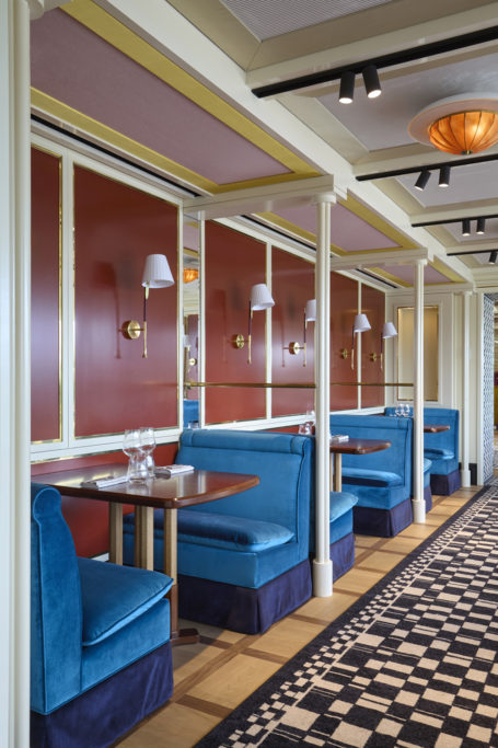 A row of blue American diner style sofas