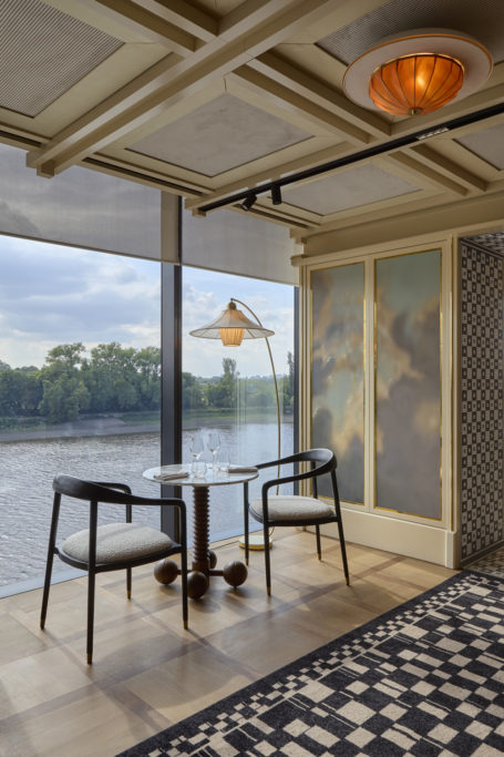 A table beside a window with views over the River Thames