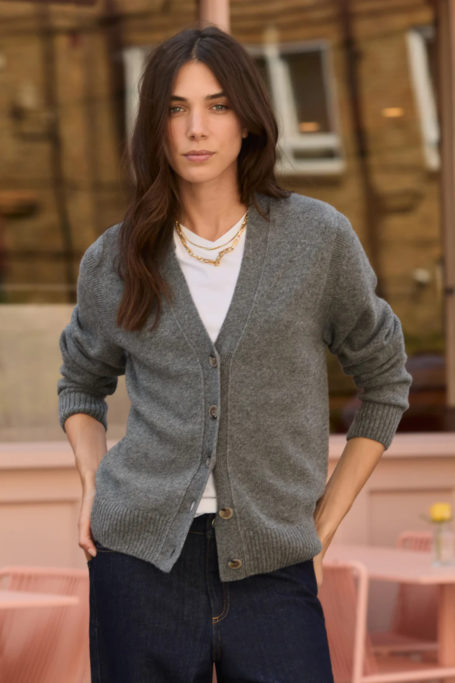 Woman wearing grey cardgian