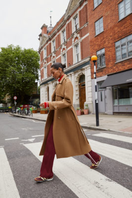 Woman walking across road in outfit from B Corp brand Baukjen