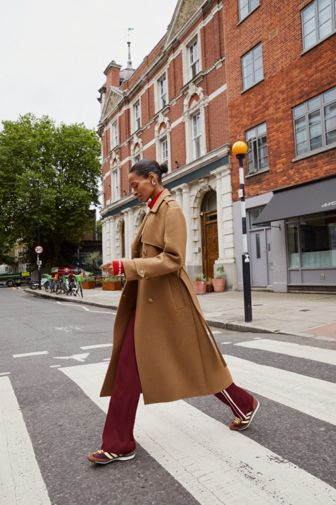 Woman walking across road in outfit from B Corp brand Baukjen