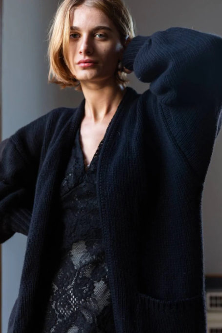 Woman wearing black cardigan