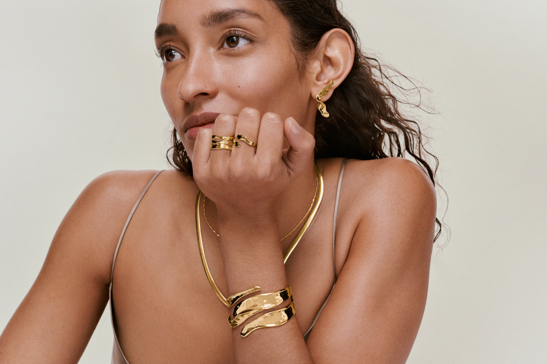 Woman wearing gold jewellery