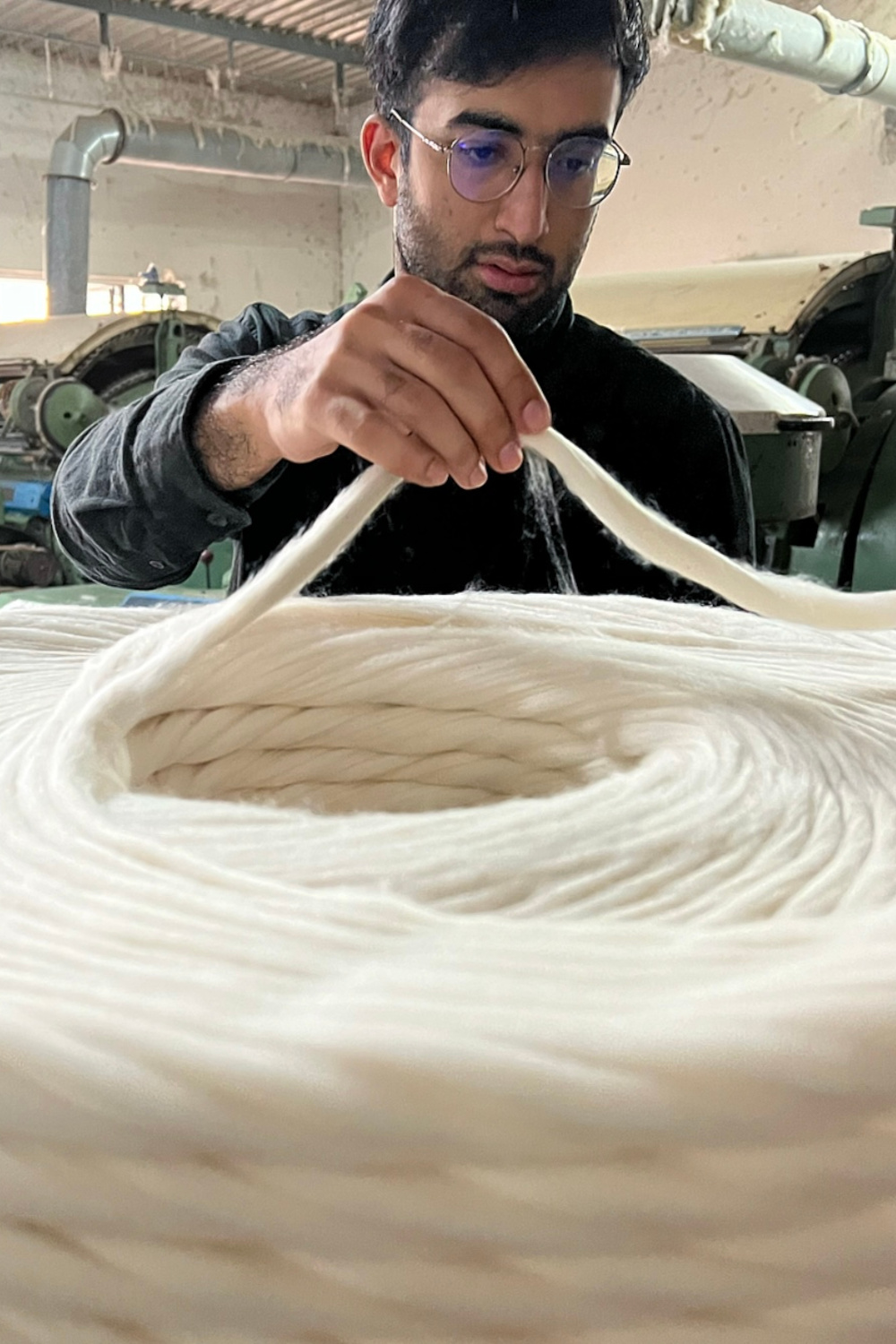Man spinning wool