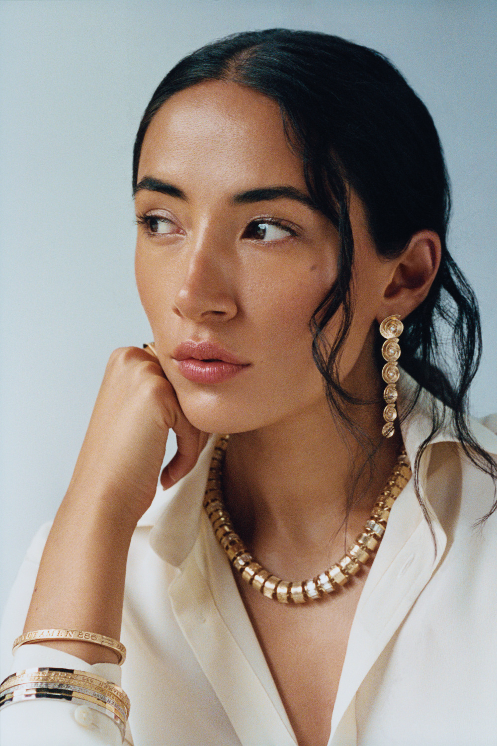 Woman wearing necklace and earrings