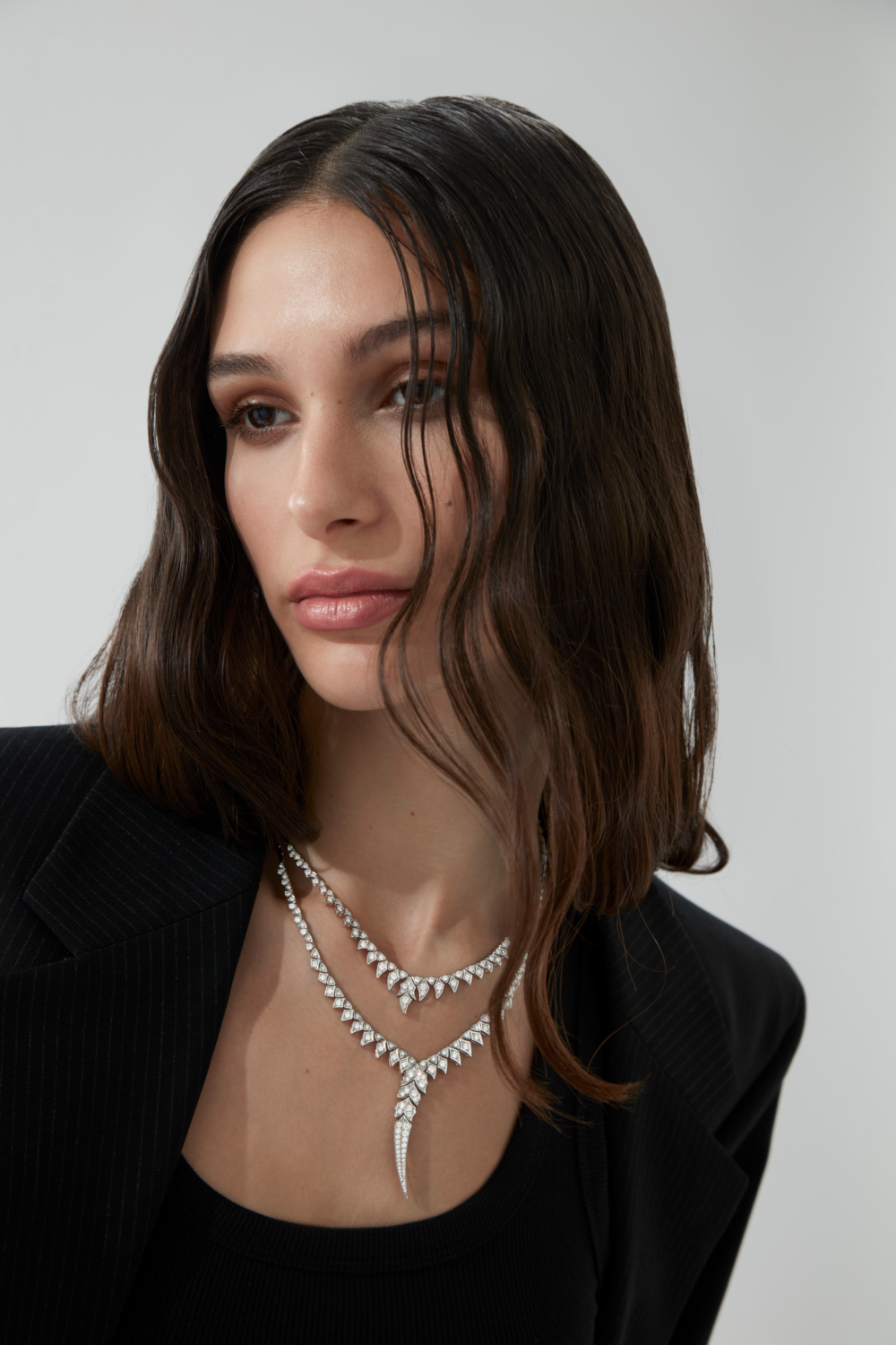 Woman wearing silver necklaces