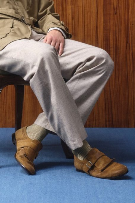 Man sat wearing shoes from British brand Church's