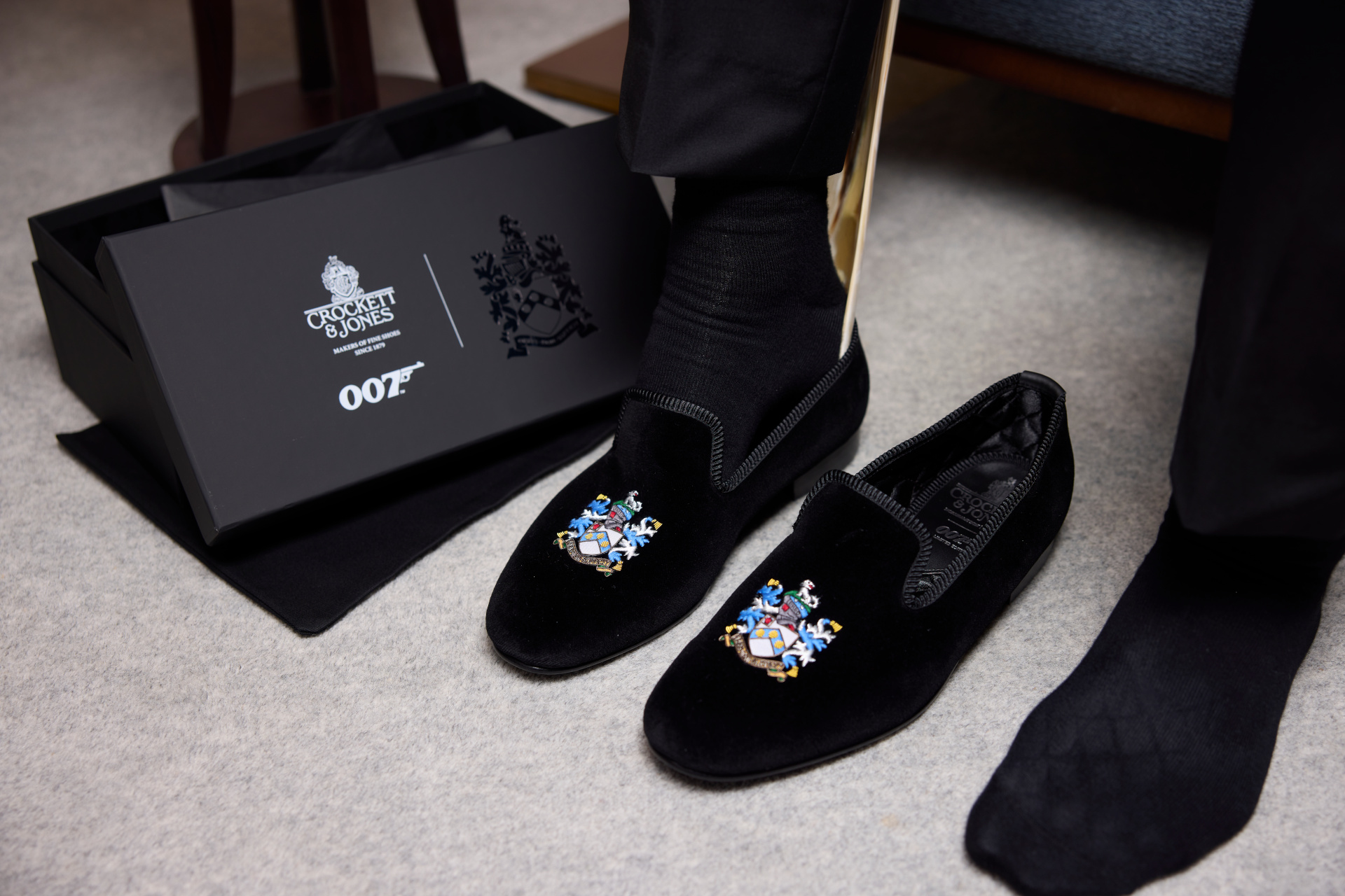 Slippers on floor with 007 packaging