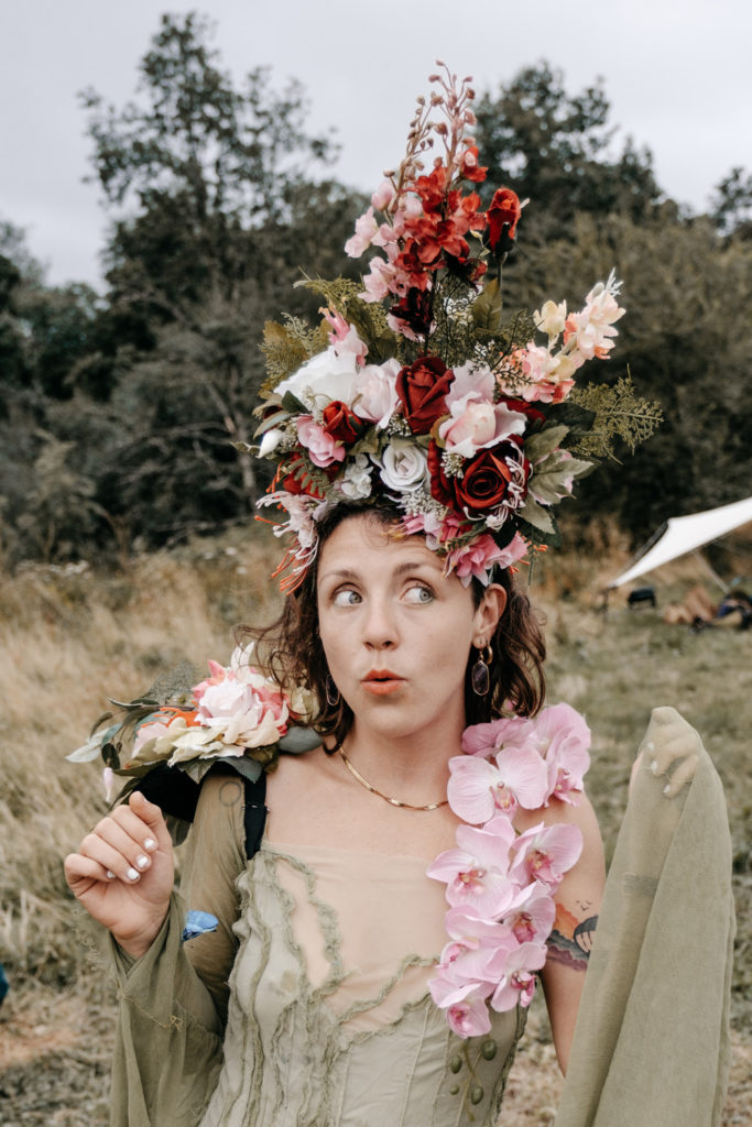 A woman at Medicine Festival with a flower headdress