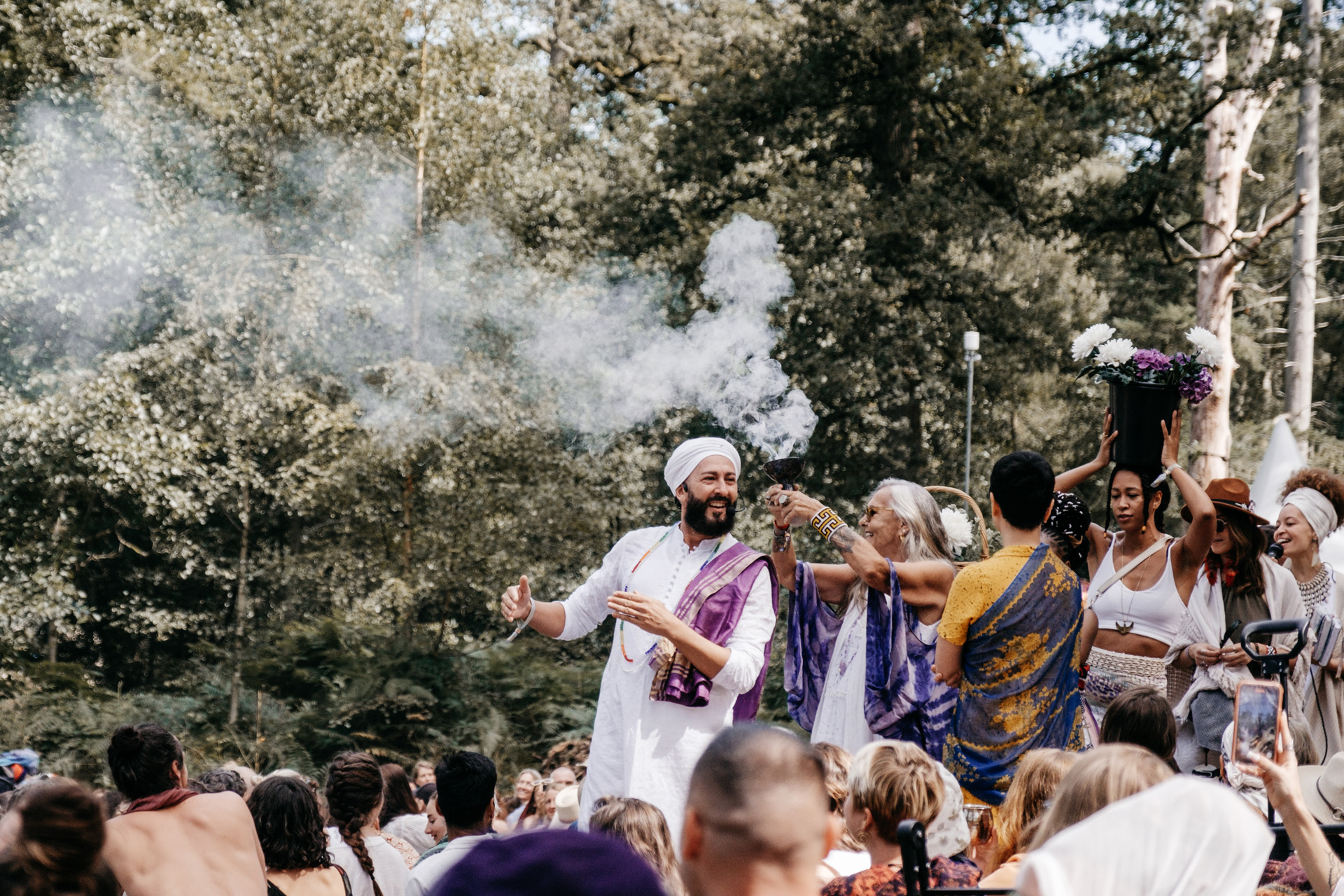 A crowd with smoke