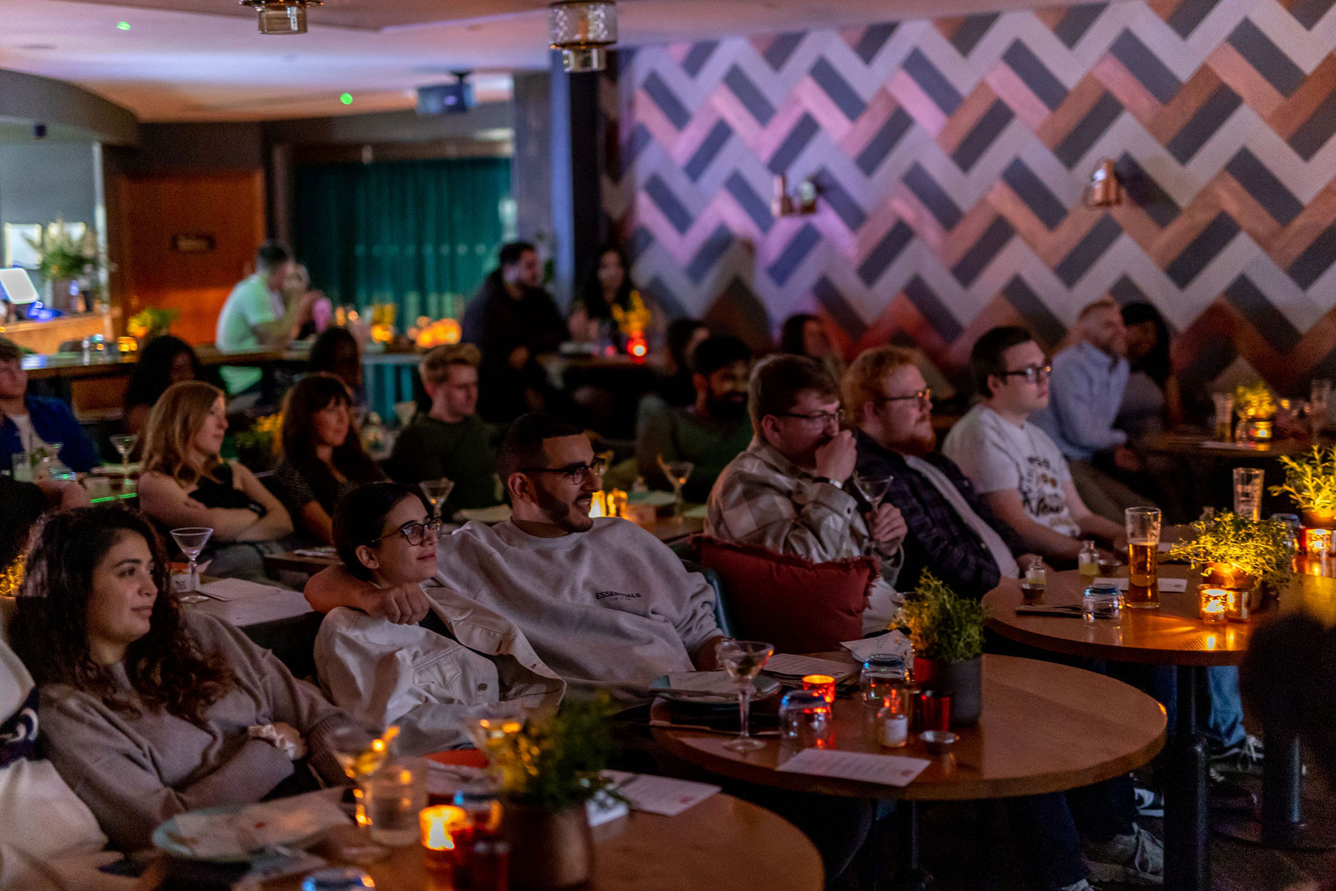 People watching a film at an immersive screening