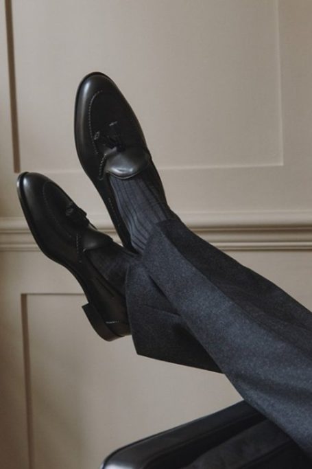 Close up of feet wearing black shoes