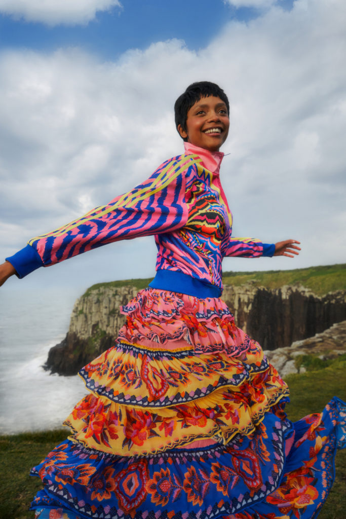 Woman running outdoors in colourful clothing