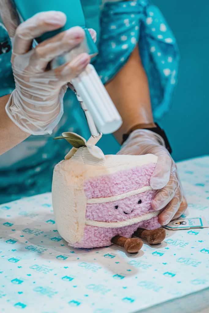 Close up of cake-shaped Jellycat plushie