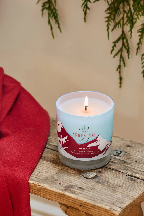 Candle on wooden side table