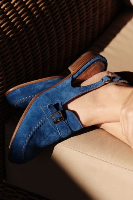 Feet wearing blue slingbacks