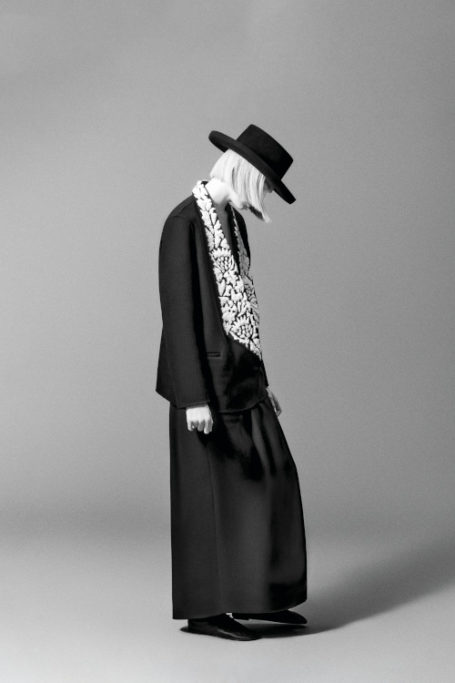 Black and white image of woman in monochrome outfit