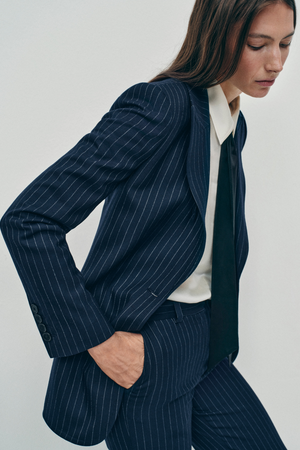 Woman in pinstripe suit
