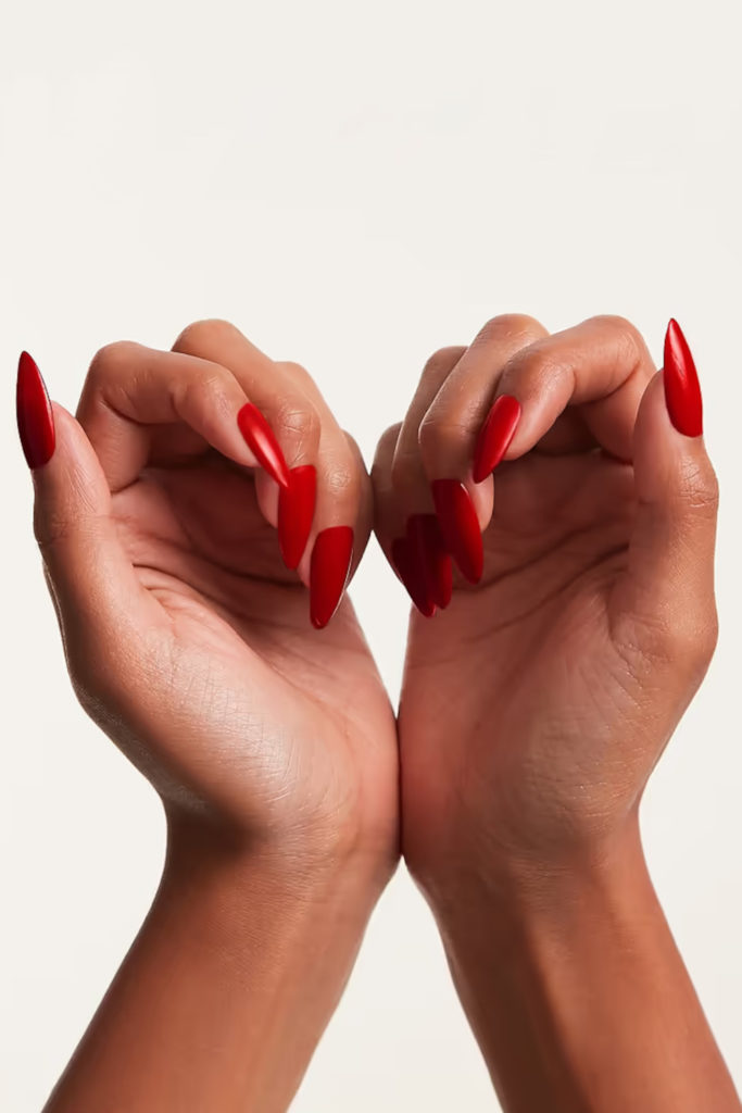 Hands with red vampire nails