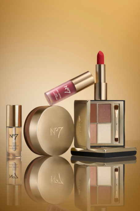 Makeup products on gold background