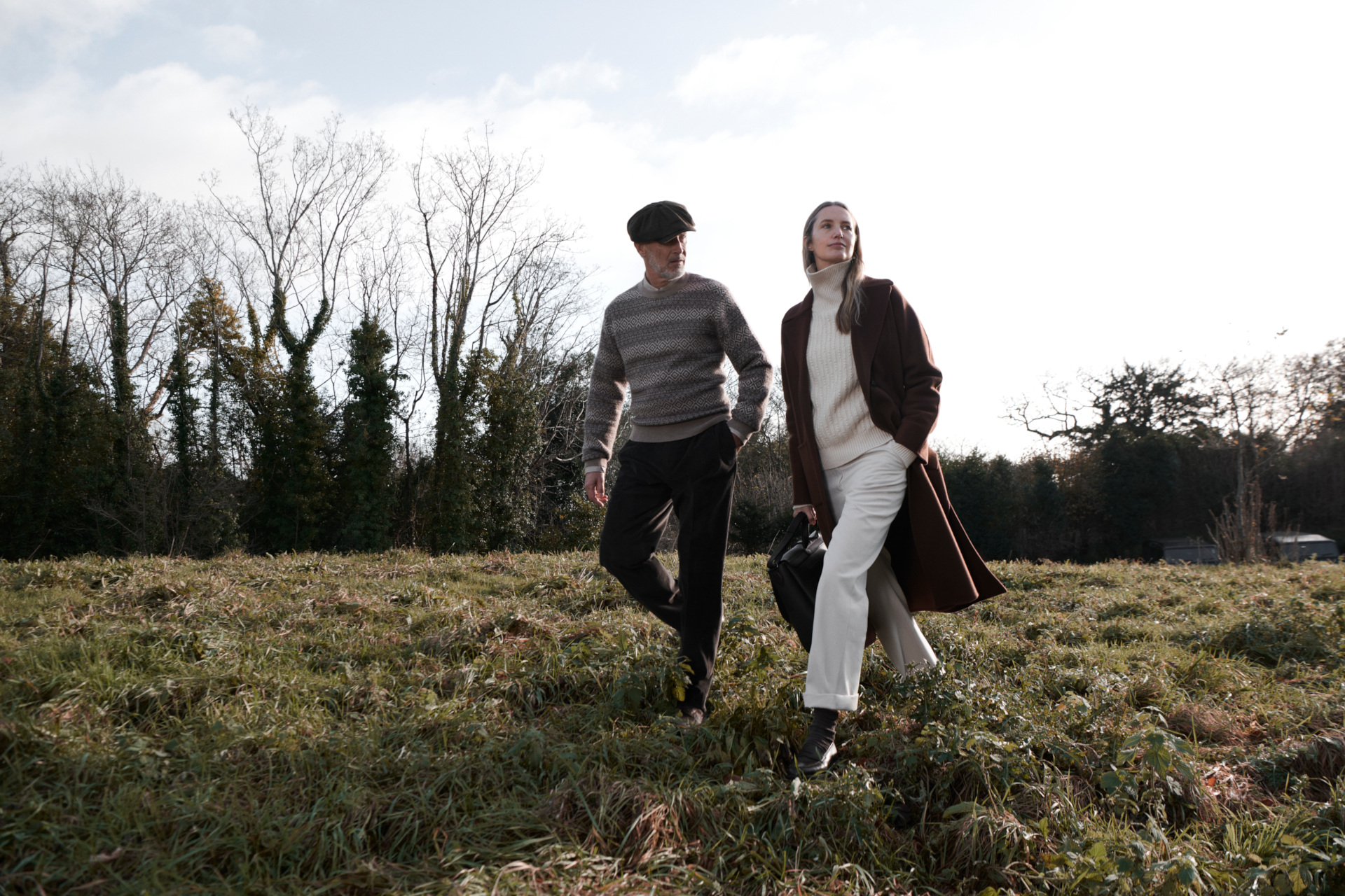 People wearing Purdey AW24 walking through field