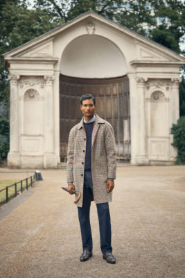 Man stood in check coat | Christmas gifts for men