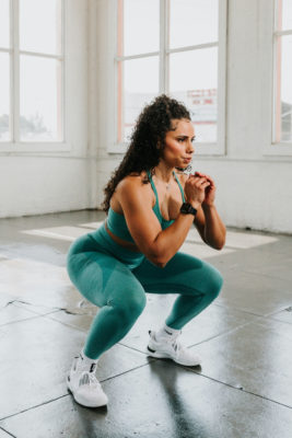 Woman doing squats for pelvic floor exercises