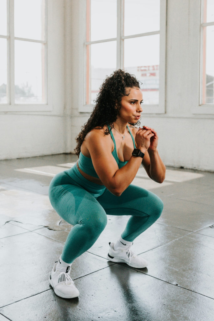Woman doing squats for pelvic floor exercises